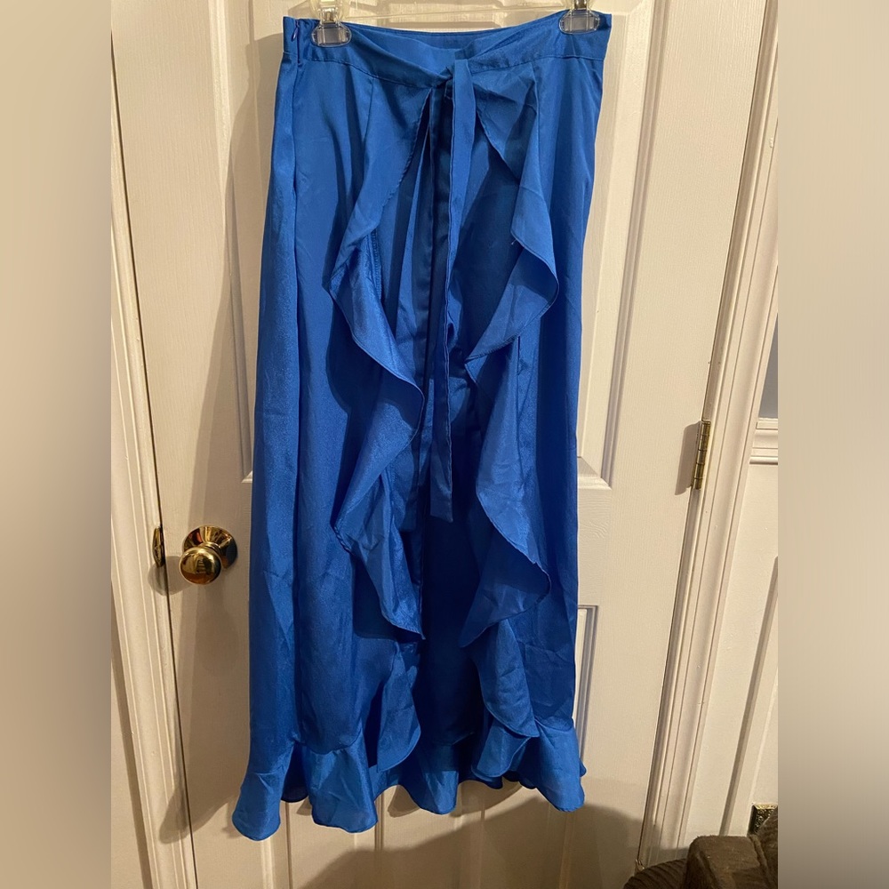 Blue pants with ruffle, faux skirt tie over.  Size M. Runs small.